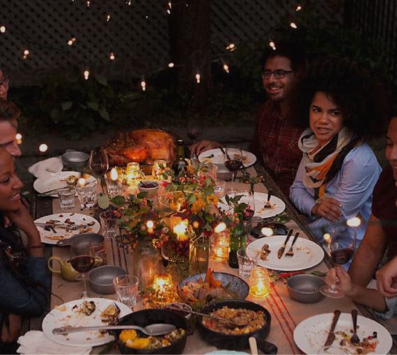 People having a conversation around a dinner table